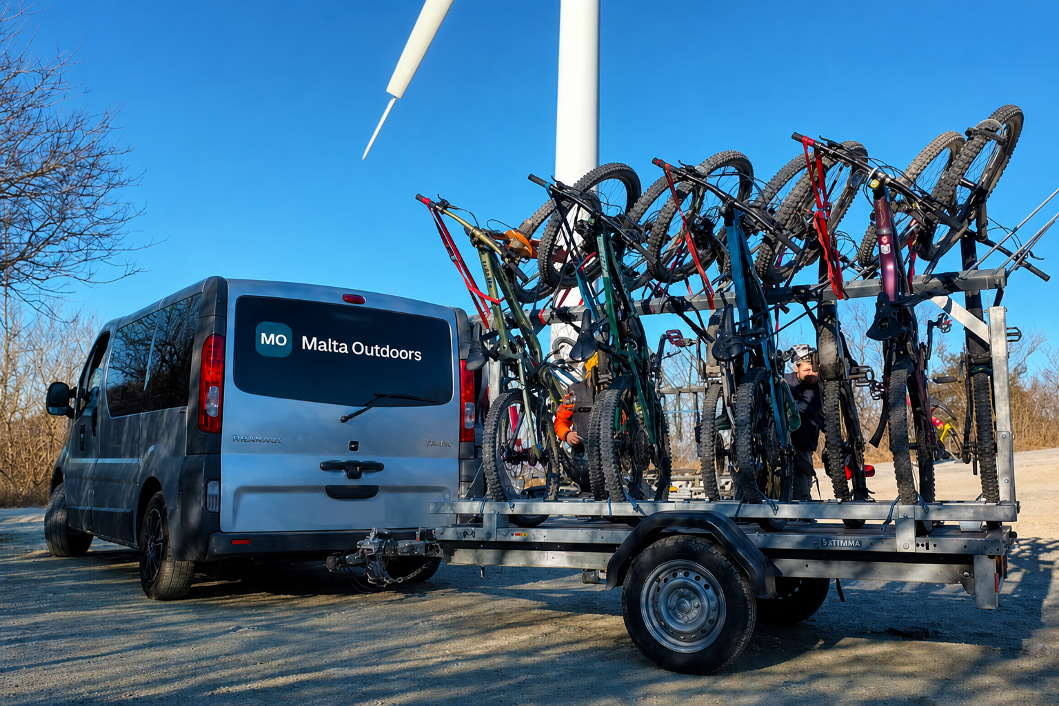Malta Outdoors van with bike trailer for mountain bike shuttle service